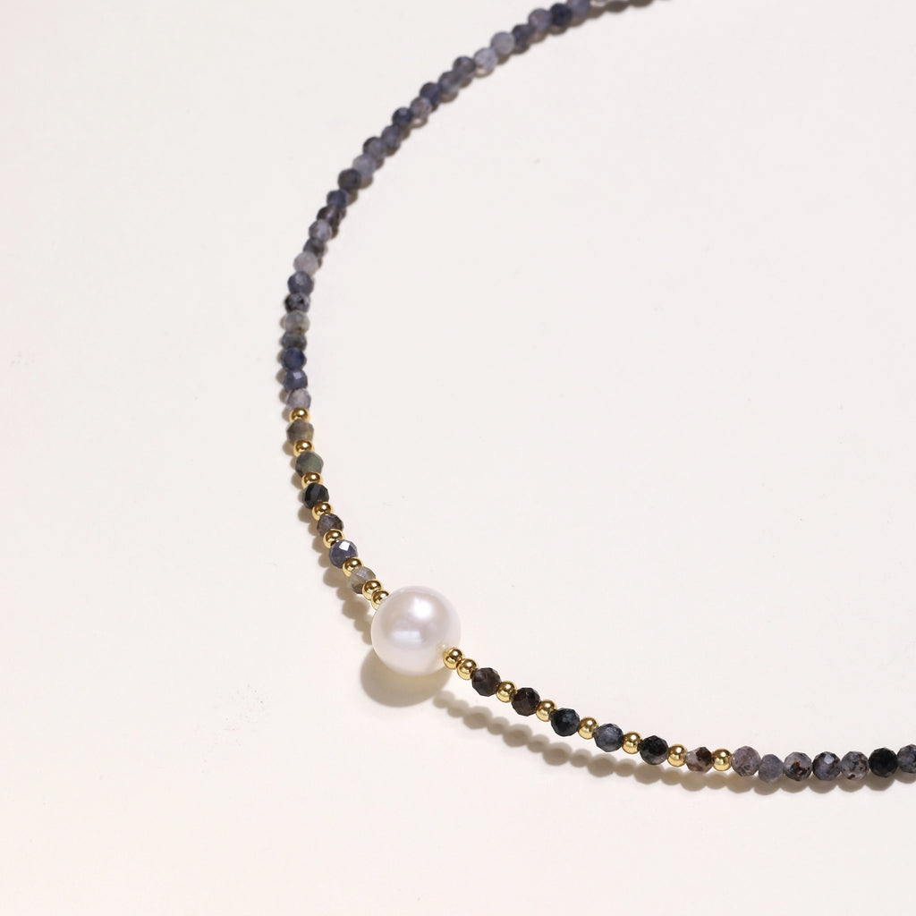 Dainty necklace with faceted purple iolite beads, gold vermeil accents, and central pink-white freshwater pearl.