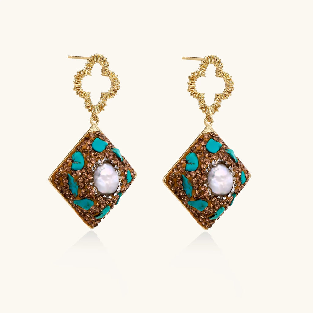 Gold-plated drop earrings with quatrefoil studs, diamond-shaped pendants featuring baroque pearls, turquoise stones, and amber crystals