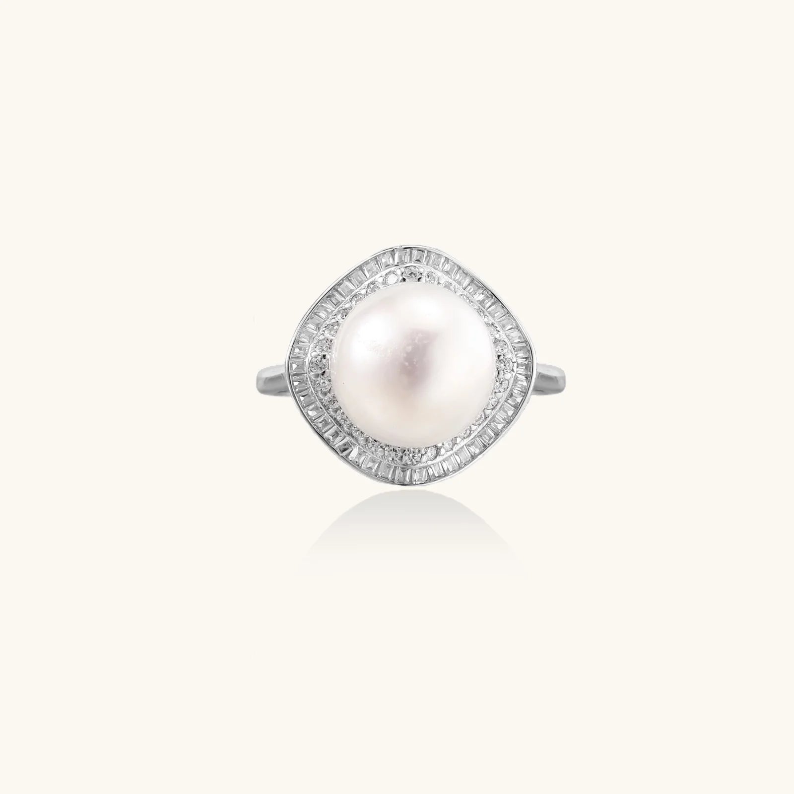 Rhodium-plated silver ring with round pearl center, double halo of baguette and round crystals forming cushion shape