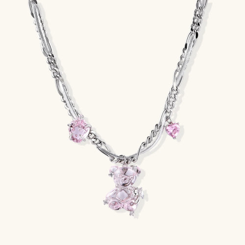 Silver twisted chain necklace with fairy tale carriage pendant adorned with pink cubic zirconia gemstones