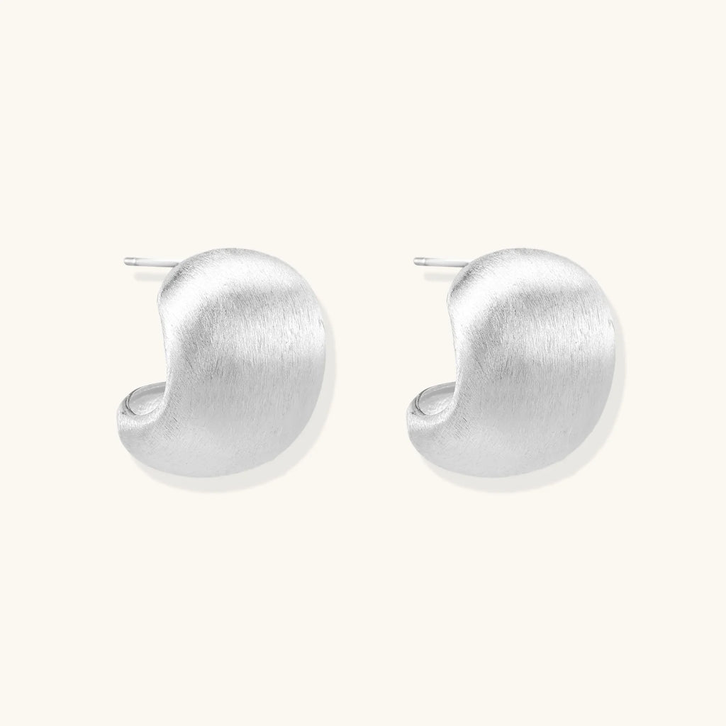 Brushed sterling silver cushion-shaped stud earrings with matte finish on white background