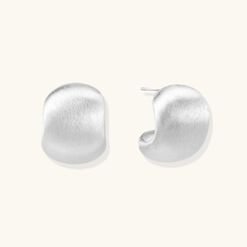 Brushed sterling silver cushion-shaped stud earrings with matte finish on white background