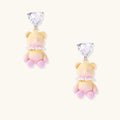 Dangle earrings with heart-cut zirconia studs and pastel teddy bear charms with pearl necklace details