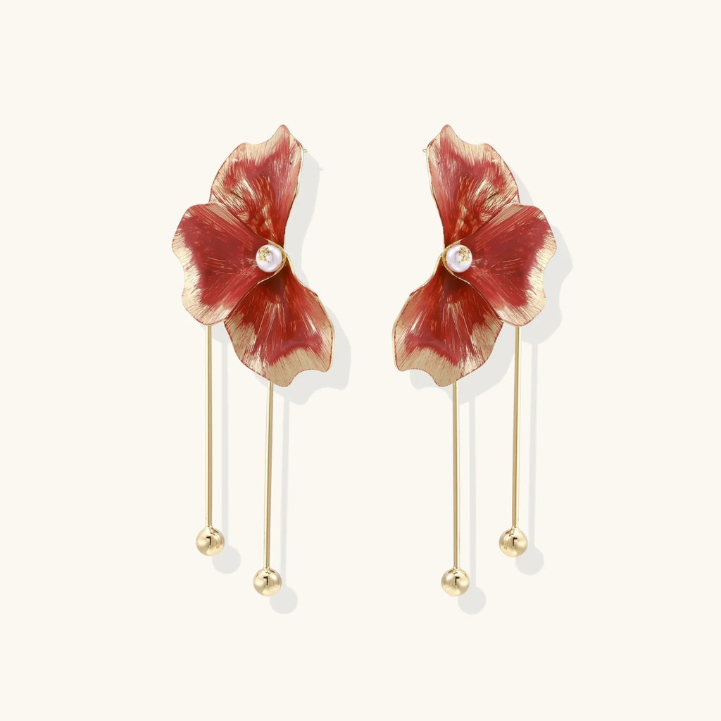 Red enamel flower earrings with gold-plated stems, central pearl, and gradient coral-to-gold petals on white background