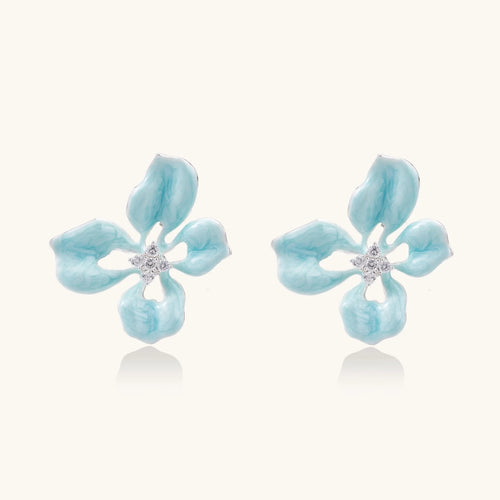 Turquoise enamel flower stud earrings with marbled finish and crystal centers on 18K gold plated brass