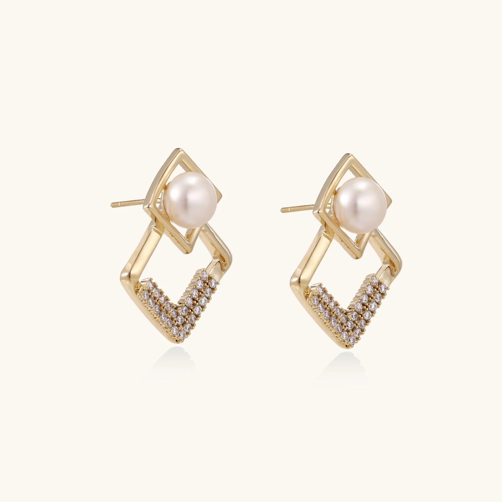 Gold-plated double square frame earrings with freshwater pearl and crystal accents on white background