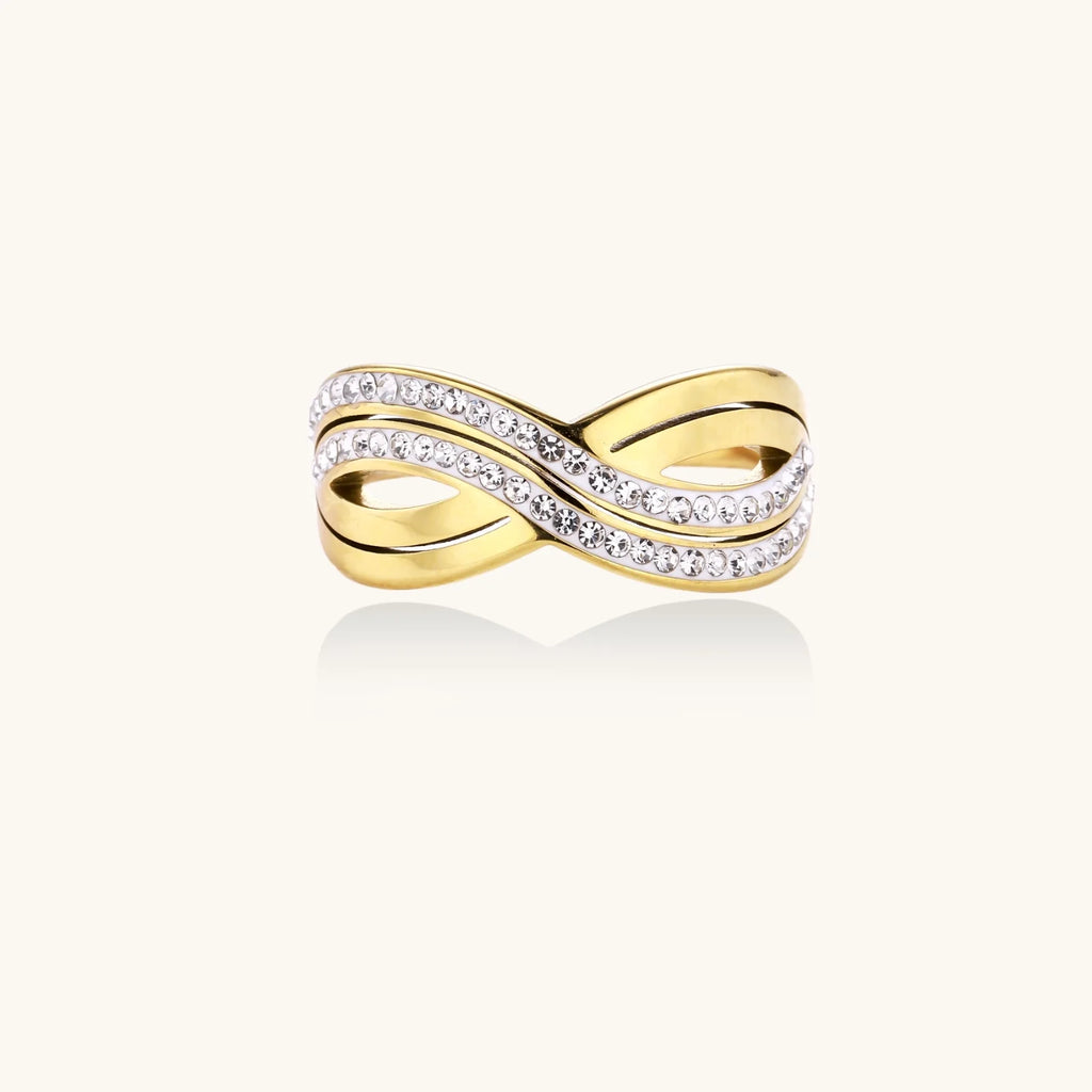 Gold-plated ring with interweaving wave bands and two rows of clear rhinestones creating an infinity pattern