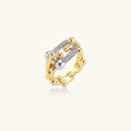 Triple-band gold ring with spherical bead chains and two crystal-pavé bars on cream background