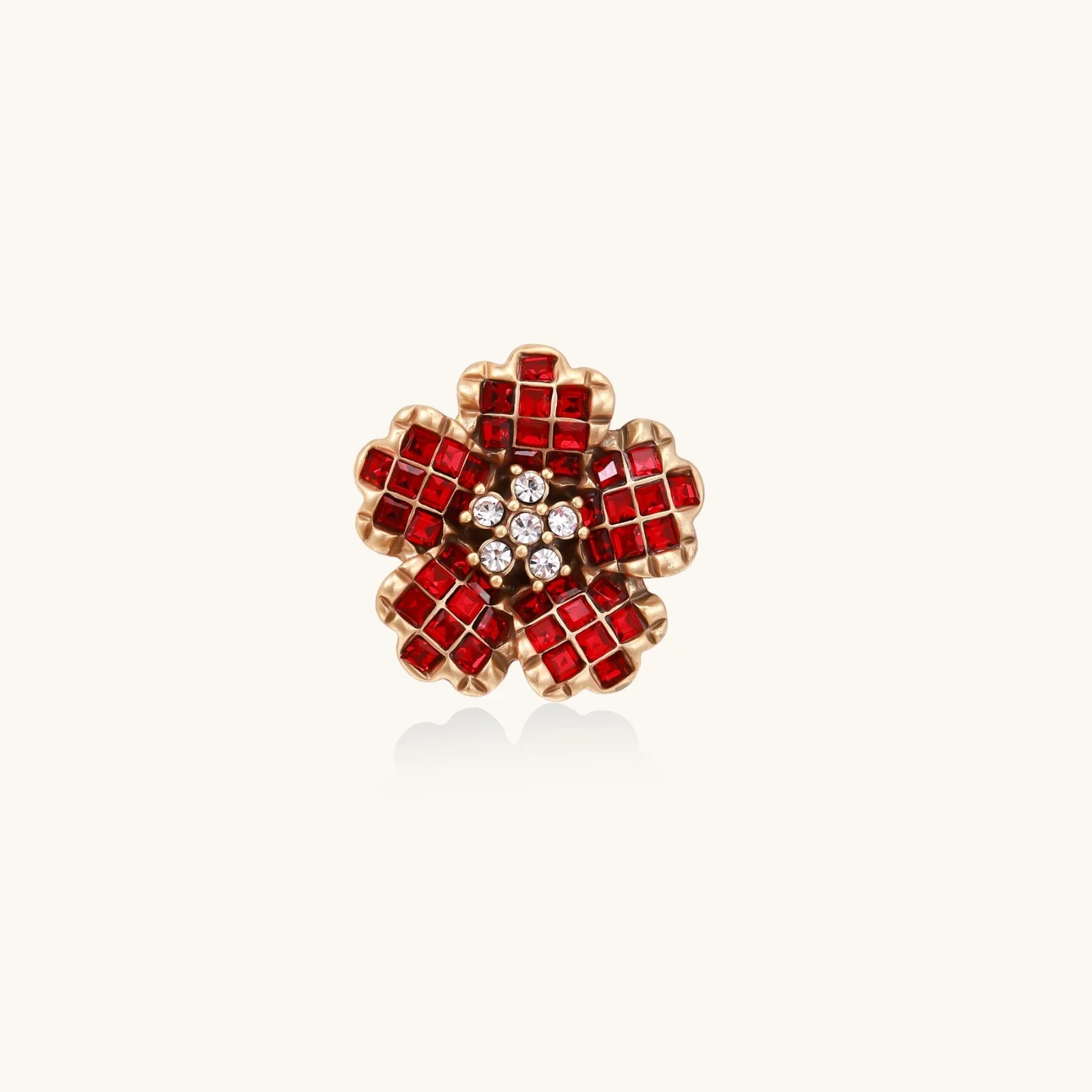 Gold-plated brass ring with red zirconia petals & crystal center in dimensional floral design