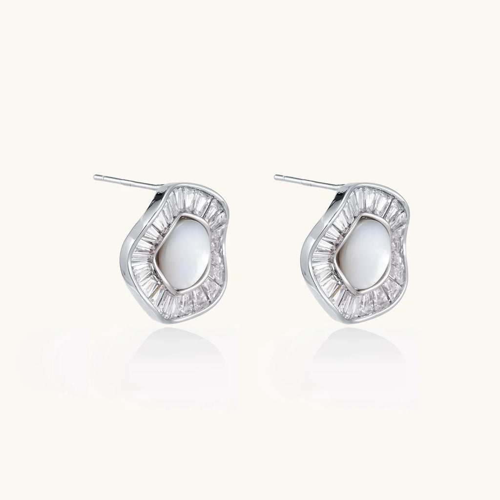 14K gold-plated stud earrings with freshwater pearl center surrounded by baguette-cut crystal halo in sunburst design