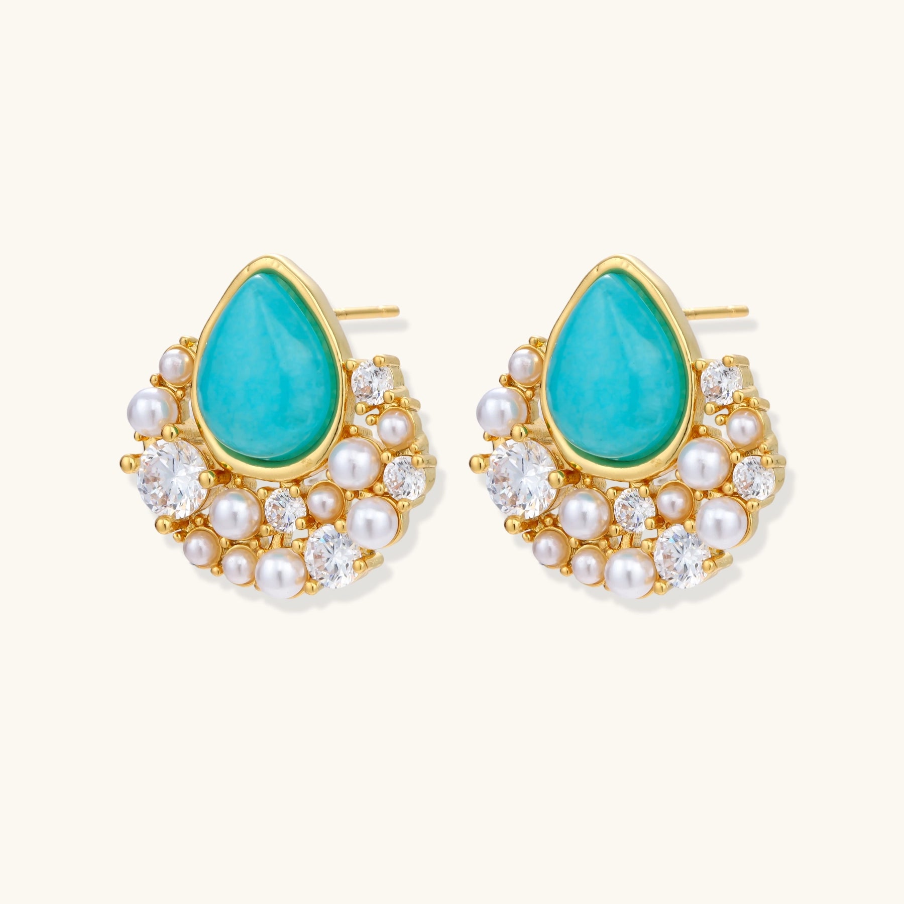 Gold-plated cluster earrings with teardrop turquoise stones surrounded by white pearls and clear crystals